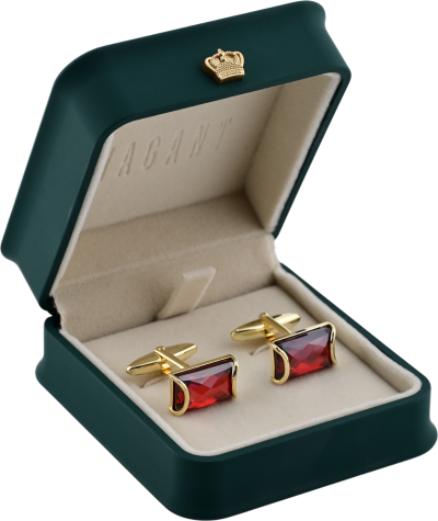 Red rectangular stone cufflinks in gold setting, displayed in VAGANT green velvet box with beige interior.