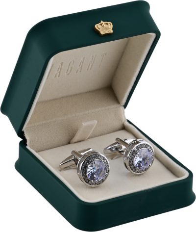 Silver cufflinks with clear round stones and crystal border in a green VAGANT box with beige interior.