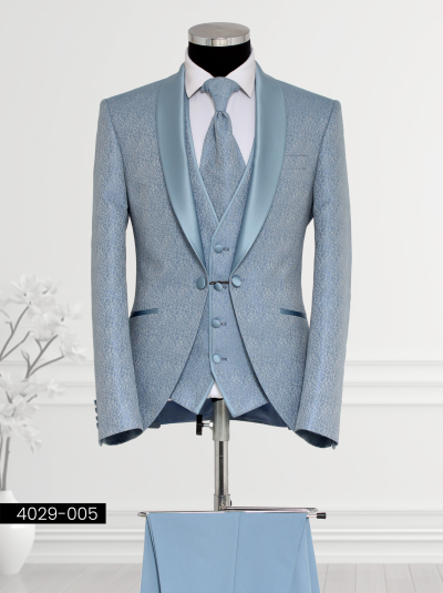 Luxury Sky Blue Suit featuring a satin shawl lapel, single-breasted patterned waistcoat, tailored trousers, and satin cravat displayed on a mannequin