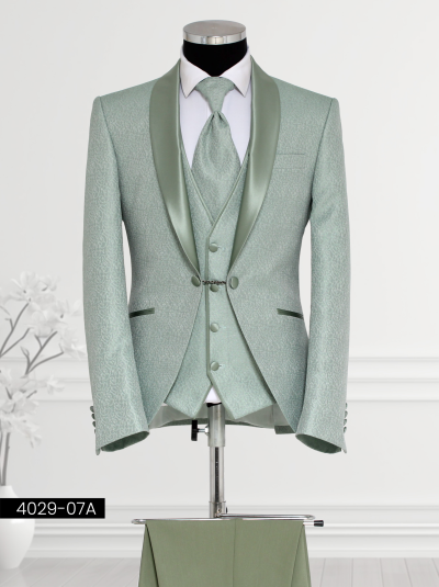 Sage Green Suit featuring a satin shawl lapel, double-breasted patterned waistcoat, tailored trousers, and satin cravat displayed on a mannequin