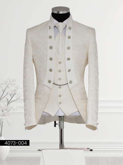 Luxurious Cream Regal Tuxedo with Mandarin Collar featuring a satin shawl lapel, double-breasted black patterned waistcoat, tailored trousers, and satin cravat displayed on a mannequin