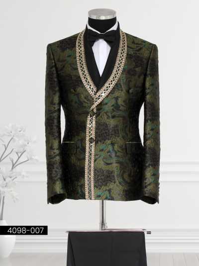 Green and black double-breasted tuxedo for men with gold geometric trim on satin shawl lapel and intricate floral patterns.