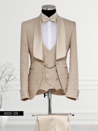 Champagne Gold Tuxedo featuring a satin shawl lapel, matching waistcoat, tailored trousers, and bow tie displayed on a mannequin