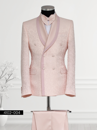 • Luxury Light Pink Double-Breasted Tuxedo featuring a satin shawl lapel, double-breasted waistcoat, tailored trousers, and bow tie displayed on a mannequin
