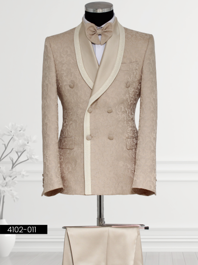 Luxury Champagne Double-Breasted Tuxedo featuring a satin shawl lapel, double-breasted waistcoat, tailored trousers, and bow tie displayed on a mannequin