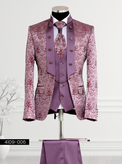 Purple tuxedo featuring burgundy floral patterns, wide lapel design with decorative buttons, double-breasted waistcoat with silver buttons and chain detail, and matching trousers.