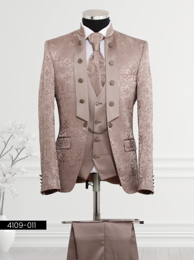 Bronze suit featuring floral brocade patterns, mandarin collar design, wide lapel with decorative buttons, double-breasted waistcoat with chain detail, and matching trousers.