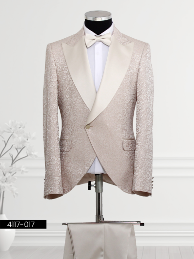 Luxury floral tuxedo in light beige with satin lapels and matching trousers and bow tie for formal occasions.