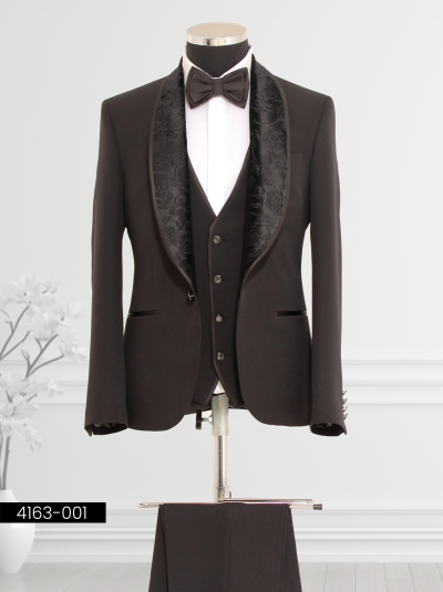 Men’s black tuxedo suit with satin jacket, coordinating vest, and bow tie, perfect for formal events.
