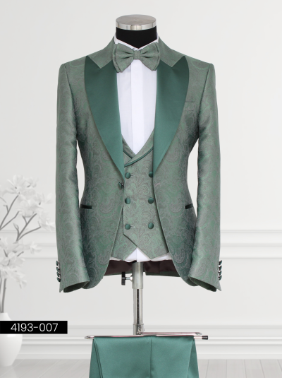 Men’s green tuxedo suit with satin lapels, paisley vest, and bow tie—ideal for formal events.