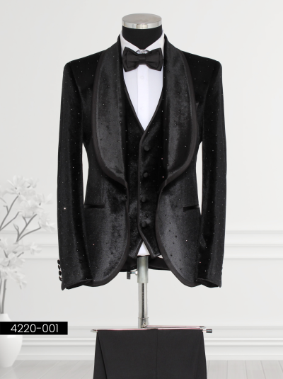 Men’s black velvet tuxedo with rhinestone embellishments, satin lapels, and waistcoat—perfect for formal events.