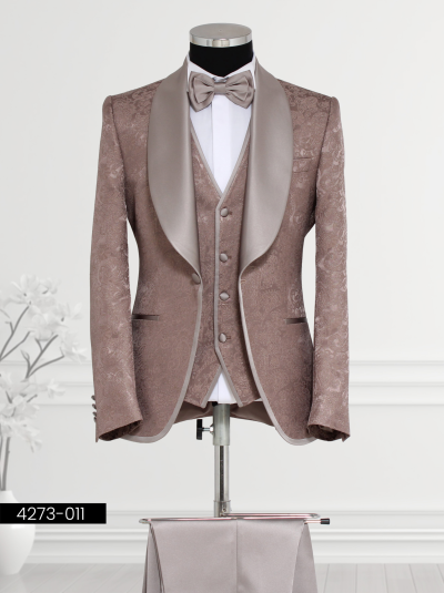Men’s beige tuxedo with satin lapels, paisley vest, and bow tie