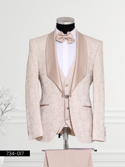 A champagne and gold tuxedo with a satin lapel, matching vest, and bow tie, displayed on a mannequin.