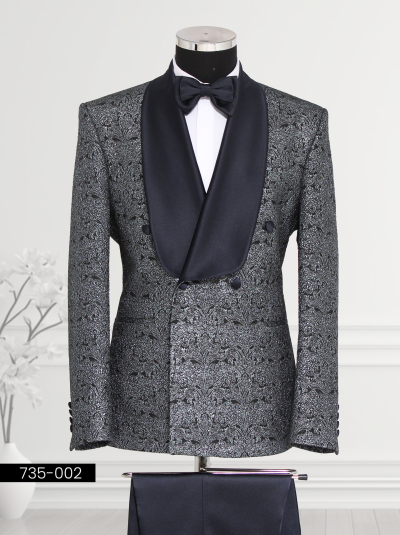 A stylish silver and black tuxedo with a satin lapel, displayed on a mannequin.