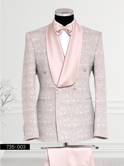 A luxury pink and white brocade tuxedo with a satin shawl lapel, matching vest, and bow tie, displayed on a mannequin.