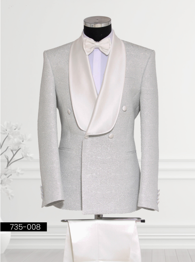 Elegant white tuxedo featuring a satin shawl lapel, matching vest, and bow tie, displayed on a mannequin.