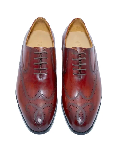 Men’s leather brogue shoes with detailed perforated patterns.
