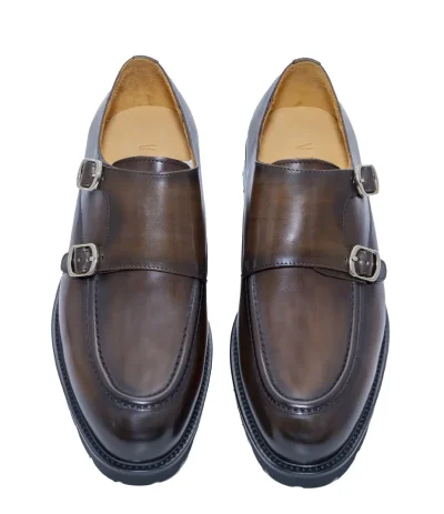 Sophisticated brown formal shoes with a polished leather finish and dual metallic buckles.